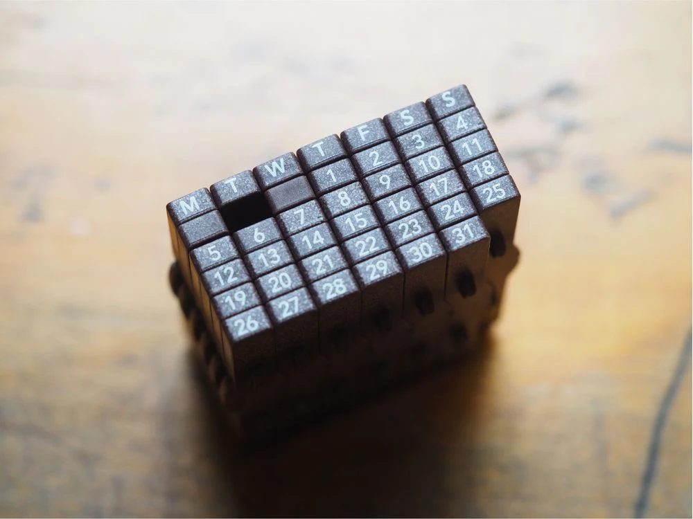 Consolidated Numeric Stamps Universal Calendar